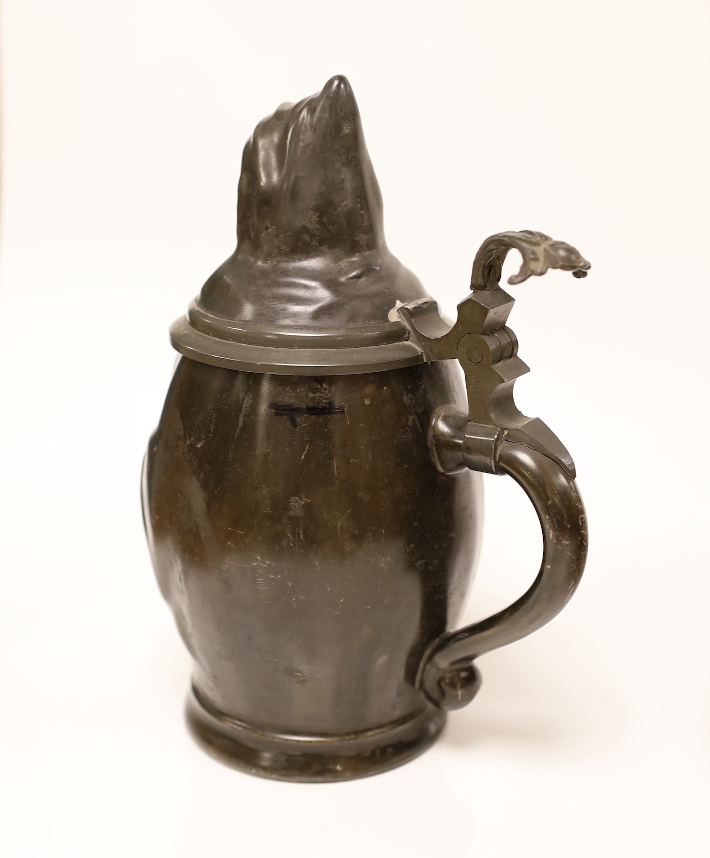 A continental figural lidded jug a carved treen comport and two Mauchline boxes, jug 21cms high